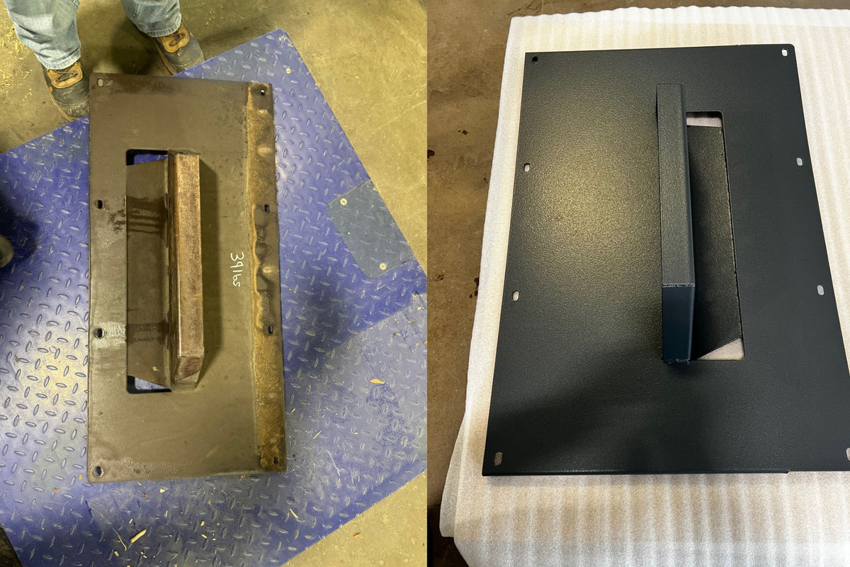 A split view of a heavy metal mounting plate or bracket with a central rectangular cutout and raised support. The left side shows the uncoated, raw metal surface on a blue diamond-plate floor with part of a person's leg visible. Powder coating done by USA Finishing